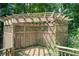 Backyard wooden pergola providing a shaded retreat for relaxation and outdoor enjoyment at 652 Trailwood Sw Ln, Marietta, GA 30064