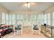 Bright sunroom featuring rocking chairs and shuttered windows at 652 Trailwood Sw Ln, Marietta, GA 30064
