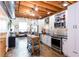 Stylish open kitchen with stainless steel appliances and a convenient island at 1661 La France Stret Ne, Unit #216, Atlanta, GA 30307