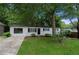 Charming single story home featuring a brick facade, well-maintained lawn and mature landscaping at 6402 Kensington Ct, Austell, GA 30106