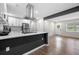Modern kitchen featuring stainless steel appliances, white cabinetry, and a large island with a breakfast bar at 6402 Kensington Ct, Austell, GA 30106
