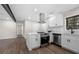 Open kitchen featuring new appliances, a center island, and white countertops at 6402 Kensington Ct, Austell, GA 30106