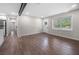 Inviting living area featuring wood-look floors, recessed lighting, and ample natural light at 6402 Kensington Ct, Austell, GA 30106