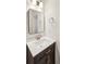 Bathroom features a vanity with dark wood cabinets and a square mirror at 8398 Members Dr, Jonesboro, GA 30236