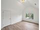 Bright bedroom with hardwood floors, sloped ceiling, window and ample space at 8398 Members Dr, Jonesboro, GA 30236