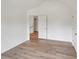 Bedroom featuring hardwood floors, large window, and closet at 8398 Members Dr, Jonesboro, GA 30236