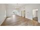 Bonus room with wood floors, neutral walls, and a chandelier, adjacent to a bathroom with a shower at 8398 Members Dr, Jonesboro, GA 30236
