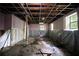 Unfinished basement featuring exposed ceiling and pink walls at 1352 Overlook Se Cv, Smyrna, GA 30080