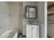 Small bathroom includes a vanity, medicine cabinet, and a bathtub at 1352 Overlook Se Cv, Smyrna, GA 30080