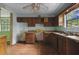 Outdated kitchen with wood cabinets and laminate countertops at 1352 Overlook Se Cv, Smyrna, GA 30080