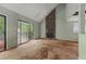 Vaulted living room featuring a stone fireplace and sliding glass doors at 1352 Overlook Se Cv, Smyrna, GA 30080