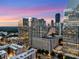 Stunning city skyline view with modern architecture and lush green spaces from the sky at sunset at 3325 Piedmont Rd Ne # 1907, Atlanta, GA 30305