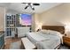 Bright bedroom features large windows with beautiful city views, neutral paint, and an ensuite bathroom at 3325 Piedmont Rd Ne # 1907, Atlanta, GA 30305