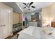 Bedroom with neutral paint, ceiling fan, large window, and crib at 3325 Piedmont Rd Ne # 1907, Atlanta, GA 30305