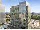 Modern glass high-rise with city views, private rooftop pool, and lounge area at 3325 Piedmont Rd Ne # 1907, Atlanta, GA 30305