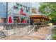 Chick-fil-A and Sub Zero Wolf Building exterior with outdoor seating and modern design elements at 3325 Piedmont Rd Ne # 1907, Atlanta, GA 30305