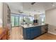 Open-concept kitchen featuring granite countertops, blue cabinets, and views of the city at 3325 Piedmont Rd Ne # 1907, Atlanta, GA 30305