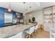 Modern kitchen with granite counters, stainless appliances, and breakfast bar at 3325 Piedmont Rd Ne # 1907, Atlanta, GA 30305
