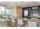 Modern kitchen with granite countertops, stainless appliances and counter seating at 3325 Piedmont Rd Ne # 1907, Atlanta, GA 30305