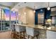 Modern kitchen with mosaic backsplash, granite countertops, and city views at 3325 Piedmont Rd Ne # 1907, Atlanta, GA 30305