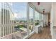 Living room features floor-to-ceiling windows that let in natural light with city views and access to the balcony at 3325 Piedmont Rd Ne # 1907, Atlanta, GA 30305