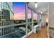 Light-filled living room with floor to ceiling windows showcases spectacular city views at 3325 Piedmont Rd Ne # 1907, Atlanta, GA 30305