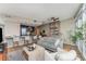 Open concept living room with an eat-in kitchen featuring granite counters, stainless appliances, and floor to ceiling windows at 3325 Piedmont Rd Ne # 1907, Atlanta, GA 30305