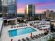Stunning rooftop pool deck features comfortable lounge seating and skyline views at 3325 Piedmont Rd Ne # 1907, Atlanta, GA 30305