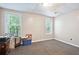 Basement with two windows, neutral walls, and ample space at 408 Victoria Place Dr, Locust Grove, GA 30248