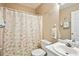 Cozy bathroom featuring patterned shower curtains and neutral walls at 408 Victoria Place Dr, Locust Grove, GA 30248