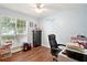 Light-filled bedroom, ideal as an office or study, with hardwood floors at 408 Victoria Place Dr, Locust Grove, GA 30248