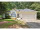 Charming single-Gathering home with attached garage, flower beds and lovely landscaping at 408 Victoria Place Dr, Locust Grove, GA 30248