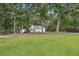 Charming single-story home with well-manicured lawn and mature trees at 408 Victoria Place Dr, Locust Grove, GA 30248