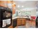 Functional eat-in kitchen boasts updated appliances and ample cabinet space at 408 Victoria Place Dr, Locust Grove, GA 30248