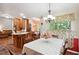 Eat-in kitchen with granite counters, wood cabinets, and stainless appliances at 408 Victoria Place Dr, Locust Grove, GA 30248