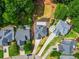 An aerial view of a residential neighborhood showcasing well-maintained lawns, mature trees, and elegant homes at 1950 Stethem Fry, Alpharetta, GA 30022