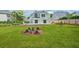 Backyard with newly sodded grass, planted shrubbery and patio at 1950 Stethem Fry, Alpharetta, GA 30022