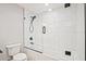 Modern bathroom featuring white subway tile and glass-enclosed tub at 1950 Stethem Fry, Alpharetta, GA 30022