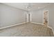 Spacious bedroom with neutral walls, recessed lights, and light wood flooring at 1950 Stethem Fry, Alpharetta, GA 30022