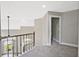 Carpeted hallway with metal railing and views from upstairs at 1950 Stethem Fry, Alpharetta, GA 30022