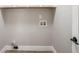 Neutral-colored laundry room with wood grain floors and washer-dryer hookups at 1950 Stethem Fry, Alpharetta, GA 30022
