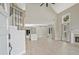 Bright open-concept living room features vaulted ceilings, new flooring, fireplace, and staircase with iron railing at 1950 Stethem Fry, Alpharetta, GA 30022