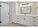 Bright main bathroom with double vanity, standalone cabinet and tiled shower at 1950 Stethem Fry, Alpharetta, GA 30022