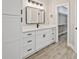 Stylish main bathroom features a black faucet, white cabinets, and modern lighting at 1950 Stethem Fry, Alpharetta, GA 30022