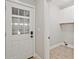 Bright mudroom features a glass panel door and white cabinets for storage at 1950 Stethem Fry, Alpharetta, GA 30022