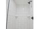 Close up of shower with black fixtures and tiled walls at 1950 Stethem Fry, Alpharetta, GA 30022