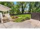 Spacious backyard featuring a wooden picnic table, a well-maintained lawn, and a private fenced perimeter at 2119 Glenwood Se Ave, Atlanta, GA 30316