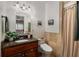 Cozy bathroom featuring granite countertop, wood vanity, neutral tile, and shower with curtain at 2119 Glenwood Se Ave, Atlanta, GA 30316