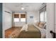 This bright bedroom boasts a ceiling fan, natural light, and stylish barn door to the bathroom at 2119 Glenwood Se Ave, Atlanta, GA 30316