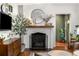 Living room fireplace featuring decorative mantle, hearth and contemporary decor at 2119 Glenwood Se Ave, Atlanta, GA 30316